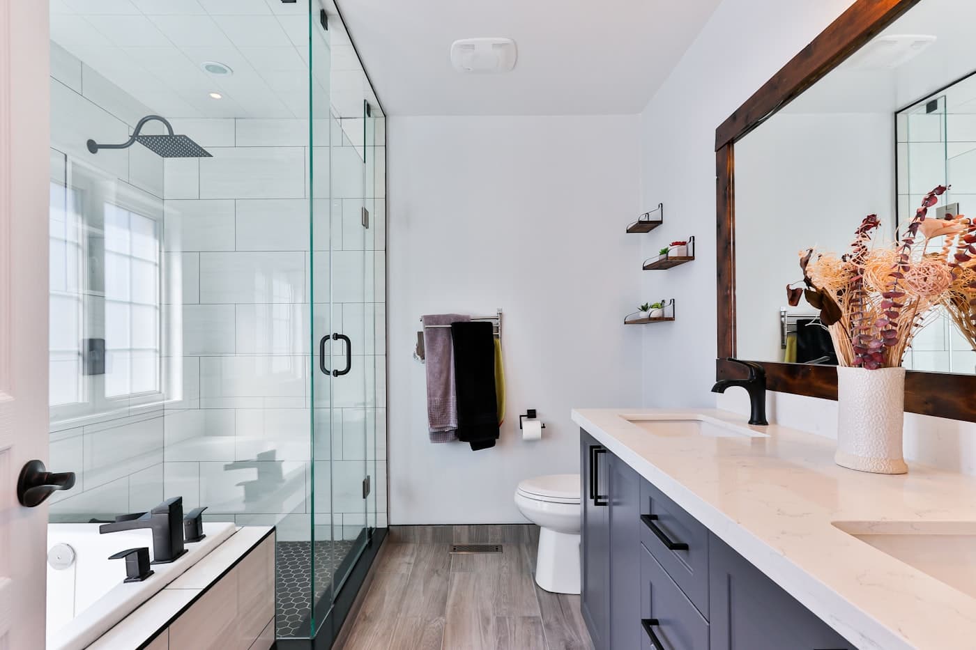 Clean bathroom with polished fixtures and folded towels